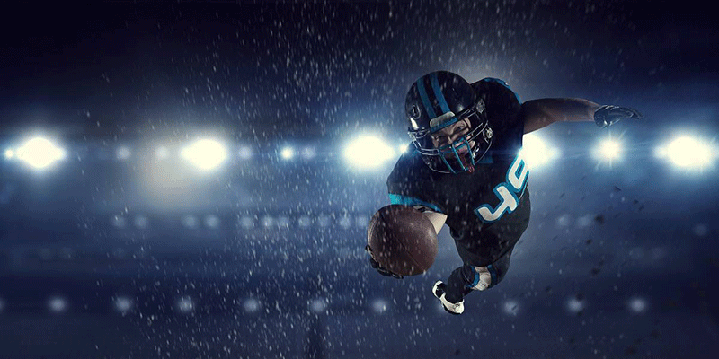 American Football Player Diving into The Endzone American Football player diving into the endzone