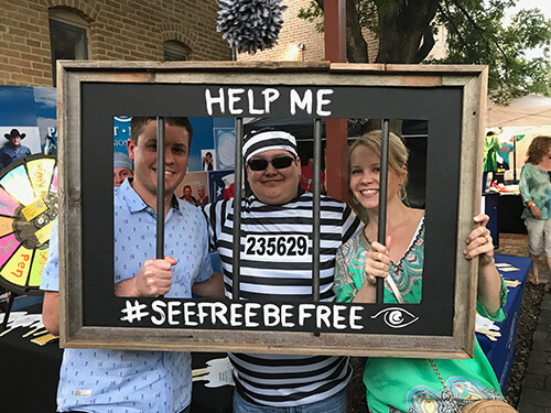 Dr.Parkhurst & Employees Dr.Parkhurst with 2 Employees behind a frame with bars