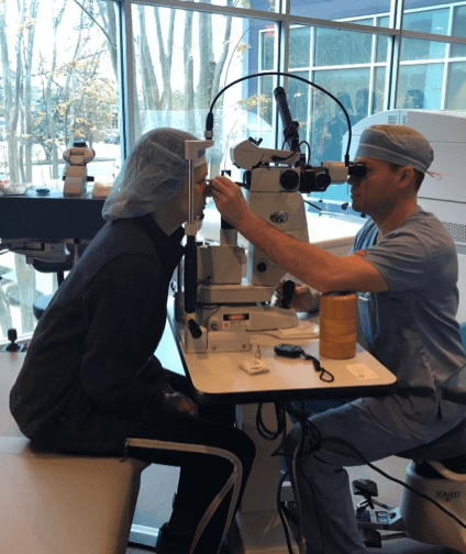 Patient Getting an Eye Exam women receiving eye exam exam from doctor