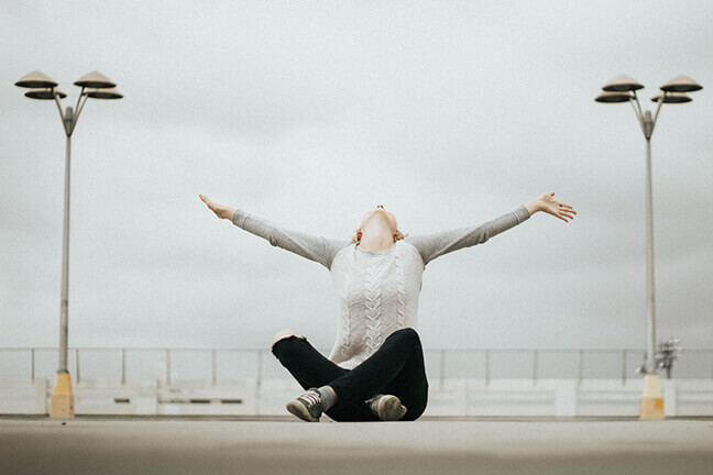 See Free, Be Free women sitting with arms open wide