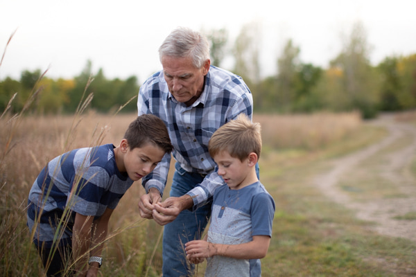Grandpa showing his grandsons something